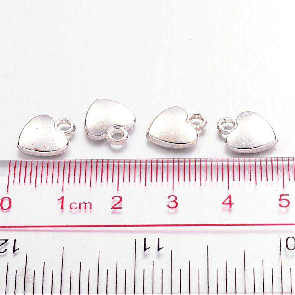 Breloque pendentif coeur argenté style tibétain