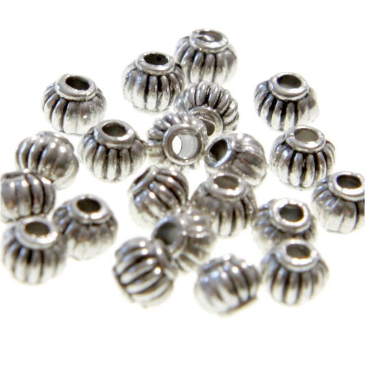 Perles metal ronde striée 4 mm