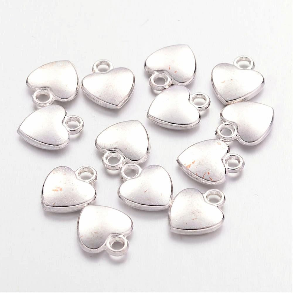 Breloque pendentif coeur argenté style tibétain