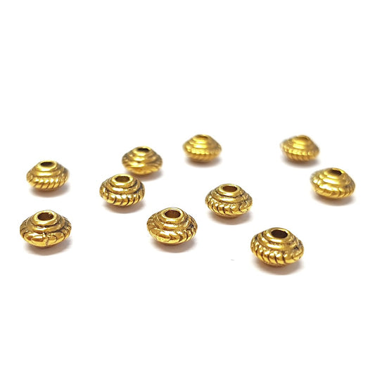 Perles metal toupie 5 x 3 mm doré